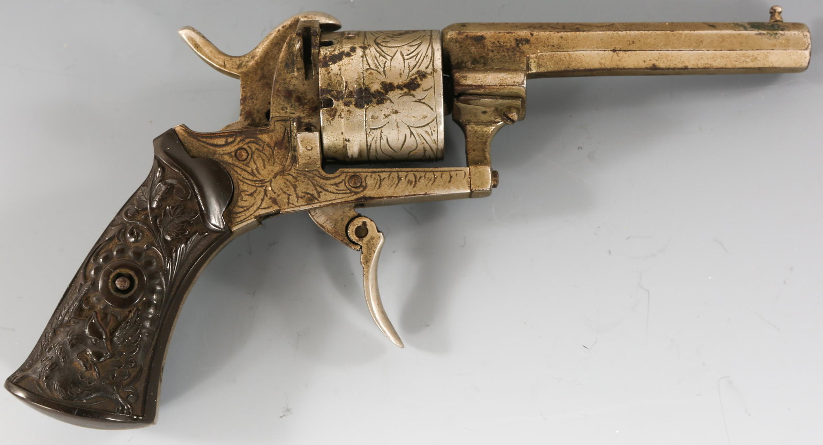 ENGRAVED BELGIAN 7mm PINFIRE REVOLVER: ENGRAVED BELGIAN 7mm PINFIRE REVOLVER Engraved Belgian 7mm pinfire revolver. Carved grips. Liege proof. Caliber / Gauge: 7mm Barrel Length: 3.25