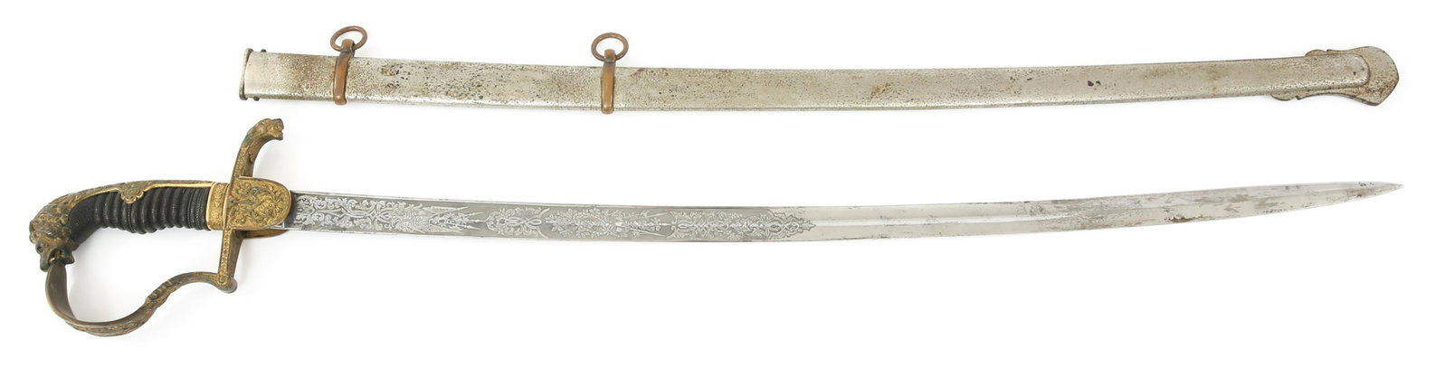 FRANCO-PRUSSIAN WAR LION HEAD ETCHED SWORD BY WKC: FRANCO-PRUSSIAN WAR LION HEAD ETCHED SWORD BY WKC Franco-Prussian War Lion Head Pommel Etched Blade Prussian Sword by WK&C. Mfg. marked ricasso below rain guard. Curved blade is bright with detailed t
