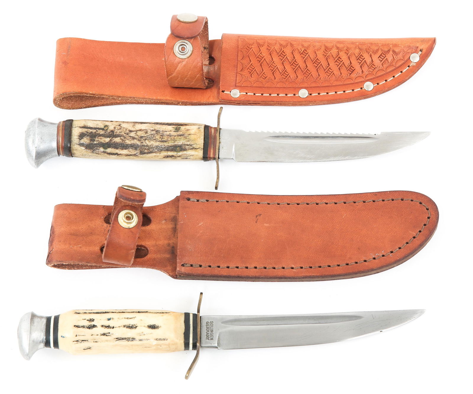 VOOS & OVERLAND SOLINGEN GERMANY KNIVES LOT OF 2: VOOS & OVERLAND SOLINGEN GERMANY KNIVES LOT OF 2 Voos & Overland Solingen, German made knives. Lot of 2. (1) Voos knife. Ricasso marked "Solingen Germany" and with the Mfg. logo. Stag handle. (1) Over