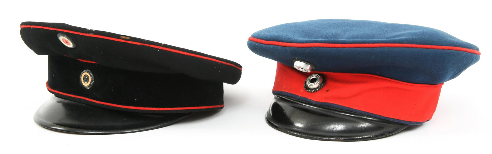 WWI IMPERIAL GERMAN OFFICER VISOR CAP LOT OF 2: WWI IMPERIAL GERMAN OFFICER VISOR CAP LOT OF 2 Lot fo 2 WWI Imperial German officer's "schirmmütze" visor caps. (1) Imperial German Prussian blue with red band and piping visor cap. Stamped inside "K