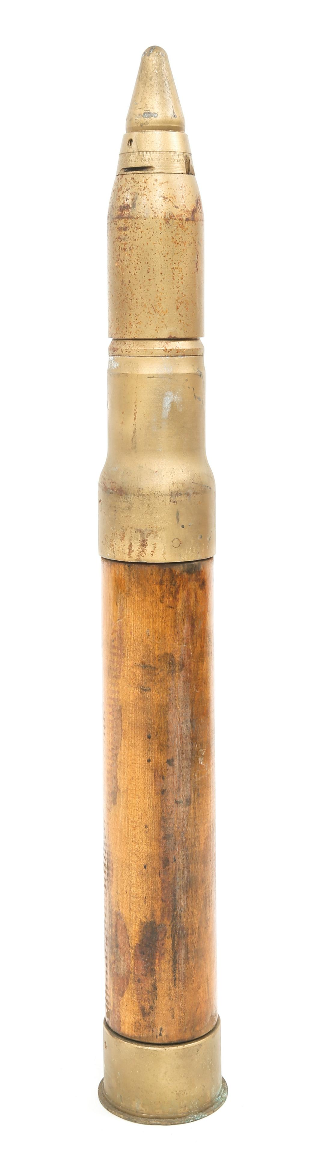 MILITARY ARTILLERY TRAINING DUMMY CARTRIDGE: MILITARY ARTILLERY TRAINING DUMMY CARTRIDGE Military artillery training dummy cartridge. Wood body. Head Stamped "Dummy Cartridge 50 Cal.". Projectile tip marked "Dummy MK. 22 Fuze". Measuring 33" in 