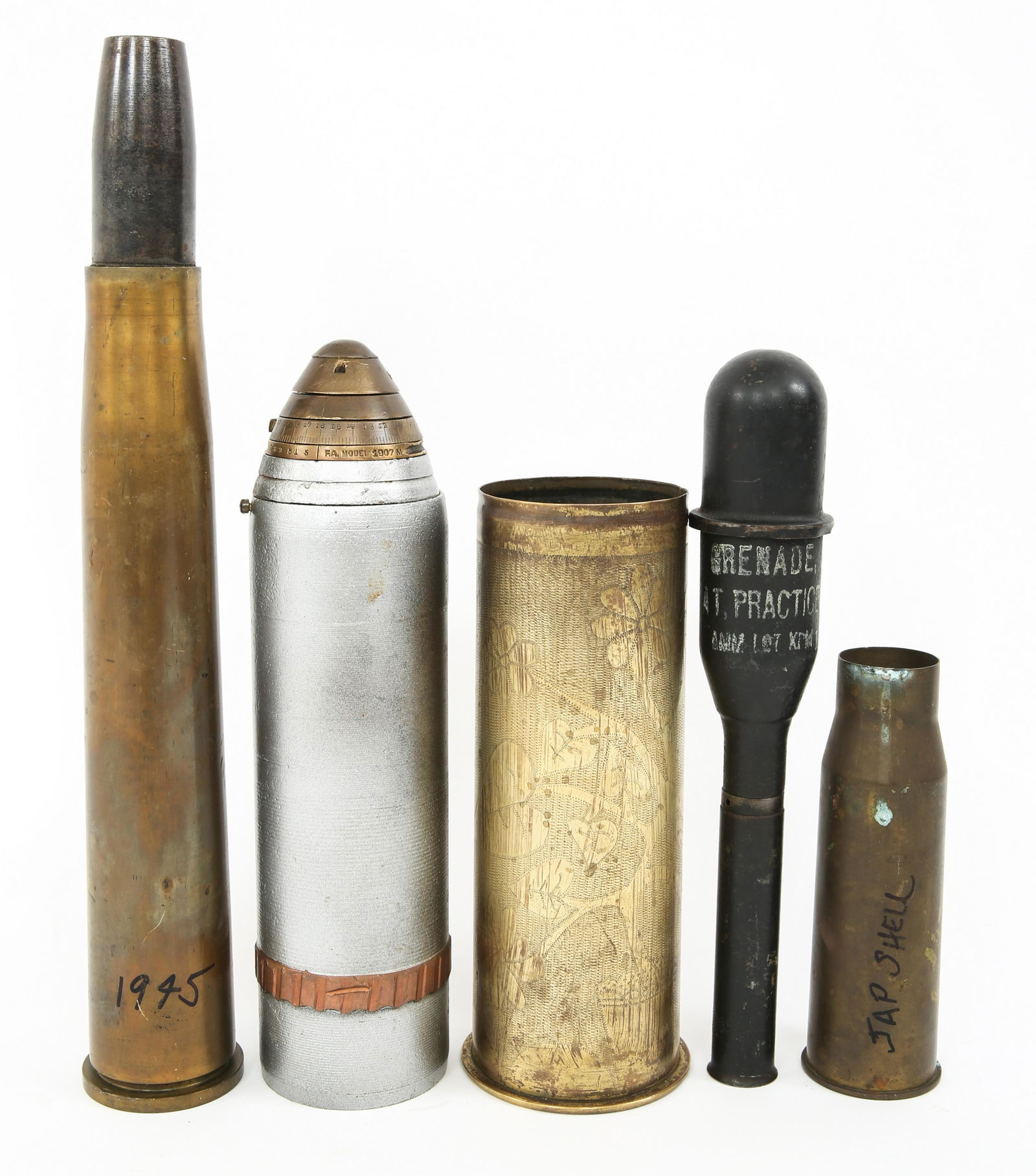 WWI - WWII ARTILLERY SHELL & TRENCH ART LOT: WWI - WWII ARTILLERY SHELL & TRENCH ART LOT WWI - WWII US Artillery Shell & Trench Art lot of 5. (1) Scovill Model 1907 M Artillery round with fuse. Painted silver. (1) German 77mm Shell case hand dec