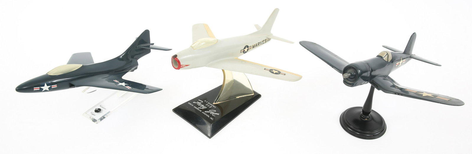 WWII - KOREA CORSAIR & JET MODEL PLANE LOT OF 3: WWII - KOREA CORSAIR & JET MODEL PLANE LOT OF 3 Lot of 3 Plastic desk model planes. (1) WWII Corsair. (1) F9 Cougar. (1) USMC FJ-3 Fury. Size: 11" to 12"