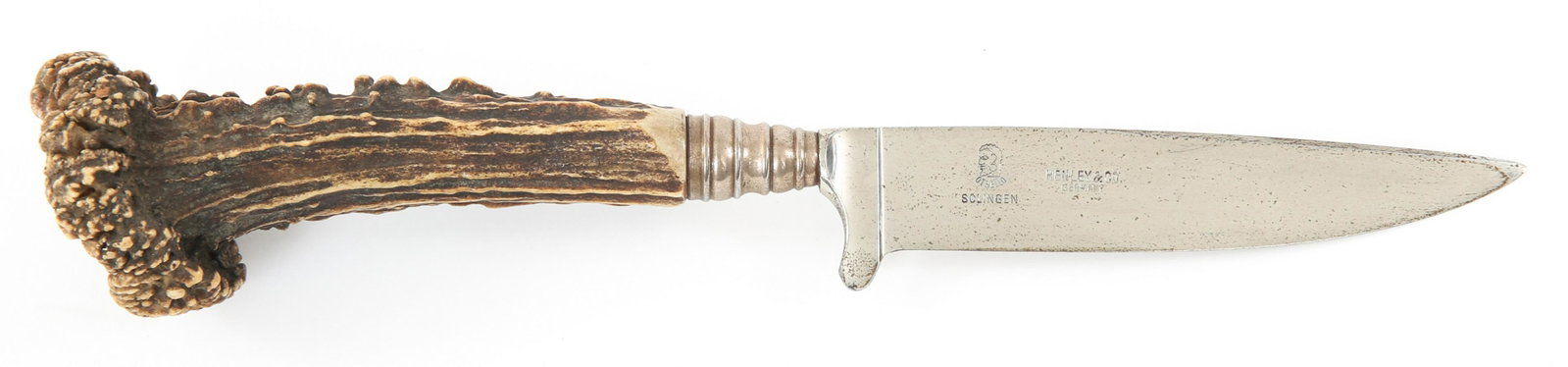 GERMAN ETCHED HUNTING KNIFE BY OTHELLO HENRY & CO: GERMAN ETCHED HUNTING KNIFE BY OTHELLO HENRY & CO German Hunting Knife by Othello Henry & Co. Partially etched / engraved blade. Marked OTHELLO SOLINGEN HENRY & CO GERMANY. Stag handle. Blade Length: 
