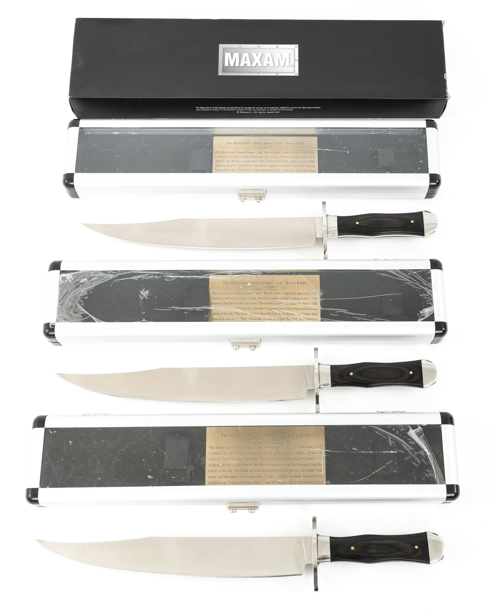 MAXMAN SKMILBWE COMMEMORATIVE BOWIE KNIFE LOT OF 3: MAXMAN SKMILBWE COMMEMORATIVE BOWIE KNIFE LOT OF 3 Lot of 3 Maxman SKMILBWE Commemorative Bowie Knives. Stainless steel clip point blade and hilt. Micarta grips. Includes presentation case. Made in Ch