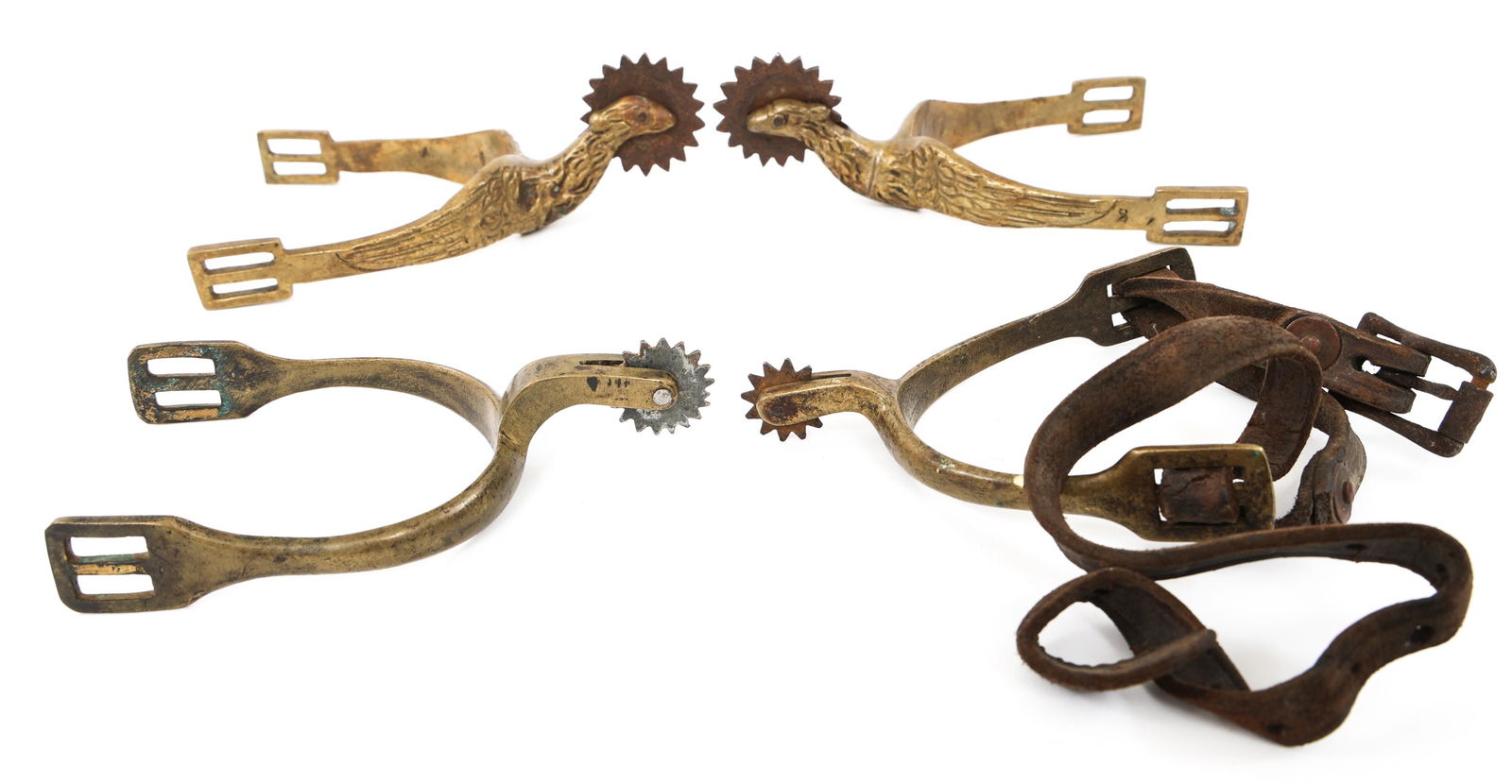 INDIAN WARS CAVALRY SPURS LOT: INDIAN WARS CAVALRY SPURS LOT Indian Wars Cavalry Spurs lot. (1) Pair of Brass Spurs with Eagle Head and large wheel. (1) Mismatched pair the Brass spurs.