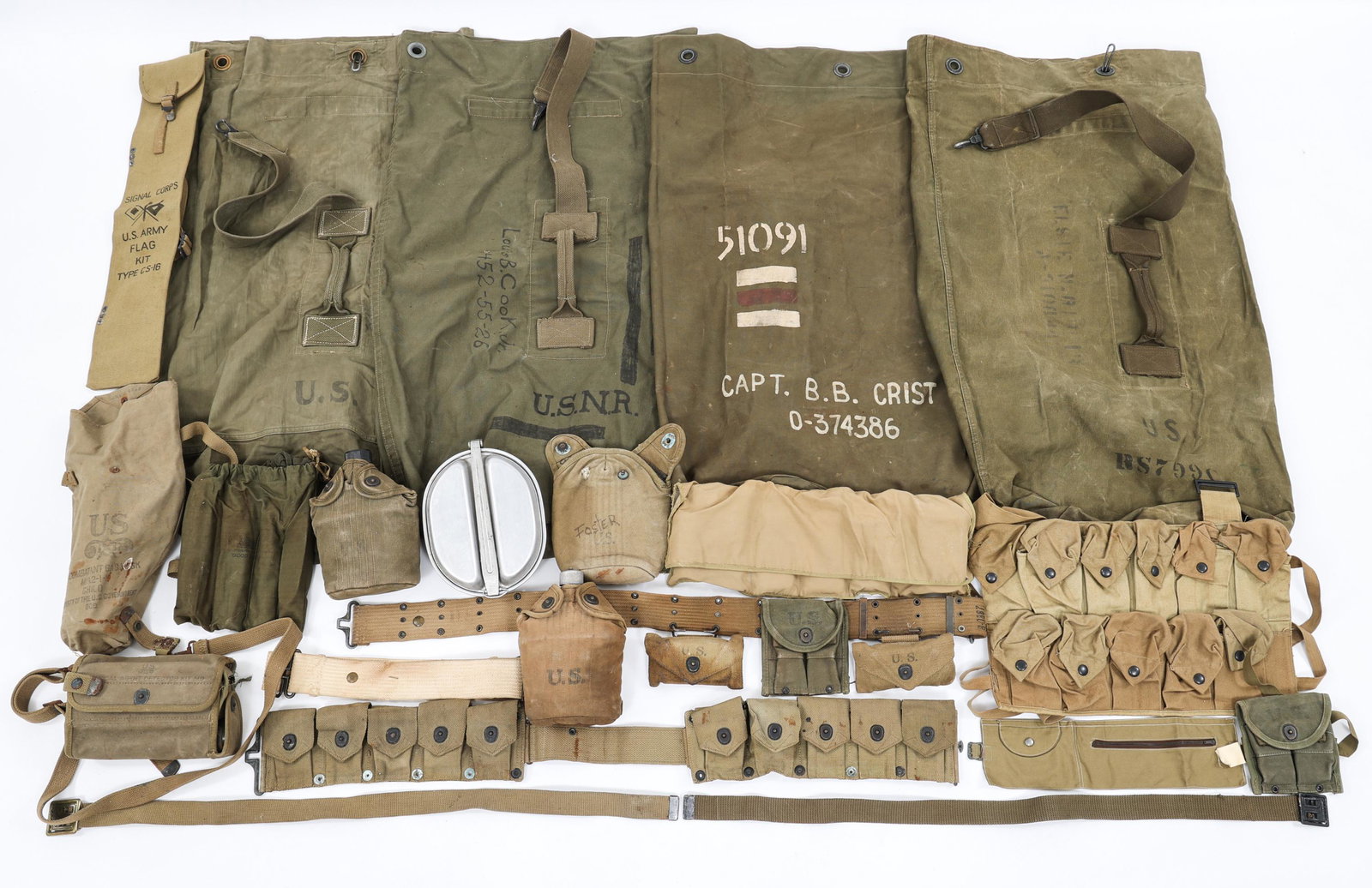 WWII US ARMY COMBAT FIELD GEAR LOT: WWII US ARMY COMBAT FIELD GEAR LOT WWII US Army field gear lot. Includes; USMC cartridge belt, Canteens, Web belt, Mess kit, Named duffle bags and more.