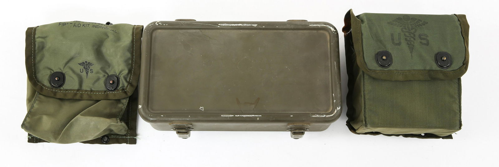 US ARMY FIRST AID KIT POUCH AND BOX LOT: US ARMY FIRST AID KIT POUCH AND BOX LOT (2) US Army Individual first aid kit pouches and some contents. (1) US Army Motor Vehicle Medical box and content.