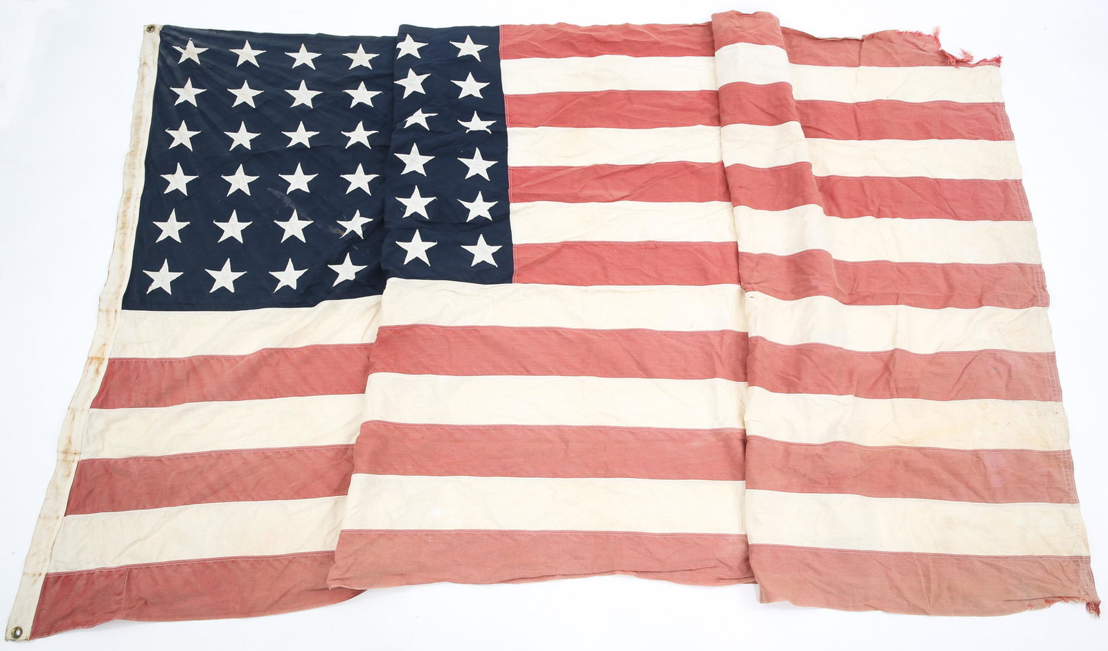 WWII UNITED STATES OF AMERICA 48 STARS FLAG: WWII UNITED STATES OF AMERICA 48 STARS FLAG WWII era United States of America 48 Stars Flag. Multiple piece construction. Cotton fabric. Size: 5' x 9'