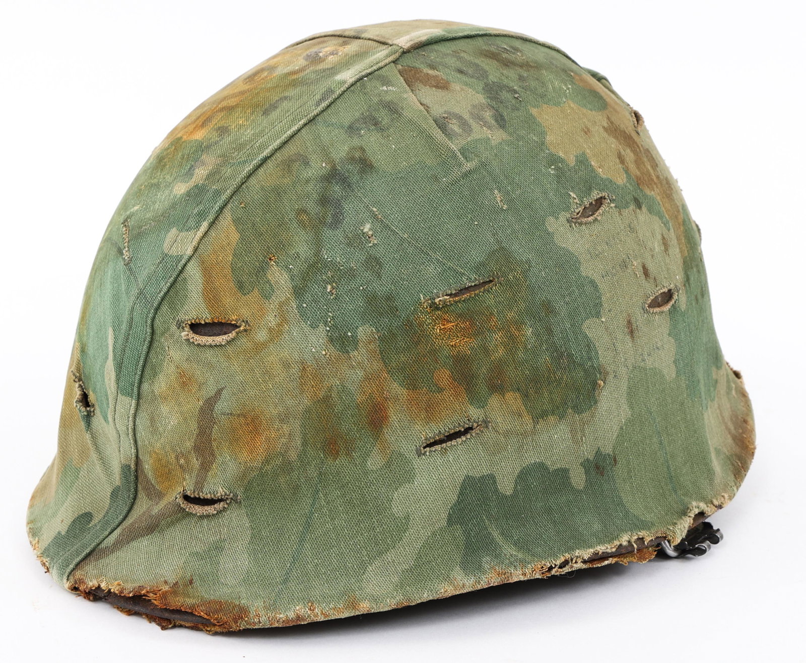 VIETNAM WAR US ARMY M1 COMBAT HELMET: VIETNAM WAR US ARMY M1 COMBAT HELMET Vietnam War Salty US Army M1 combat helmet with Mitchell camo cover. Westinghouse liner with OD7 webbing. Some Wartime period graffiti on the cover but hard to see