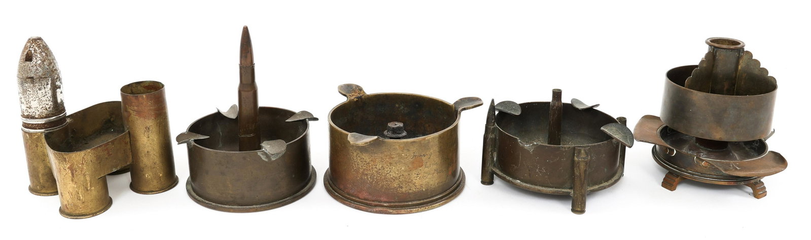 WWI - WWII US ORDNANCE TRENCH ART ASHTRAY LOT: WWI - WWII US ORDNANCE TRENCH ART ASHTRAY LOT Lot of 5 WWI - WWII US Ordnance Trench Art Ashtrays. Size: 5" Diam