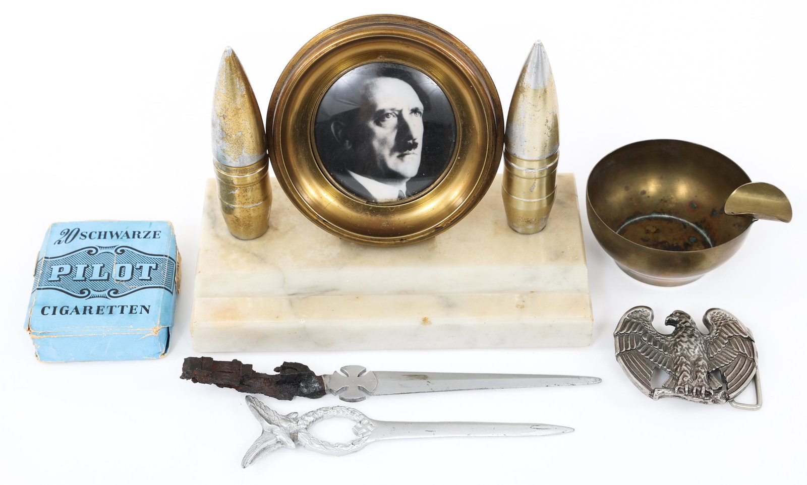WWII GERMAN TRENCH ART - LETTER OPENER & CIGARETTE: WWII GERMAN TRENCH ART - LETTER OPENER & CIGARETTE WWII German trench art and Personal gear lot. (1) Custom made Desk Top Display with Adolf Hitler portrait picture. Marble base with ordnance round cu