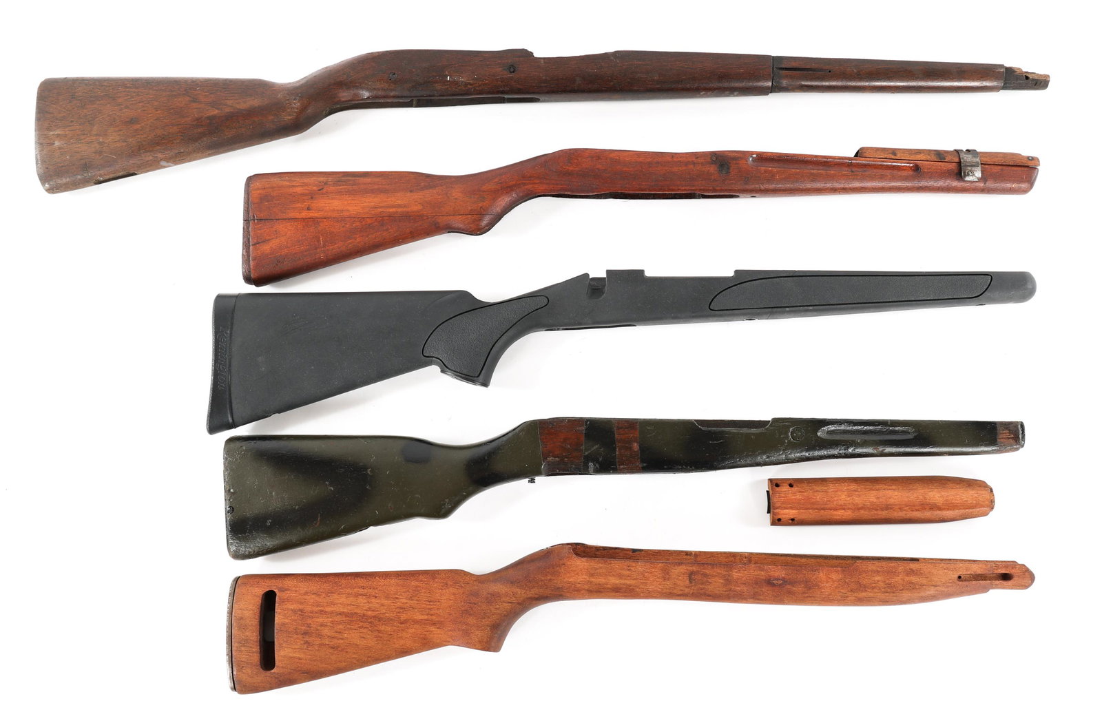 RIFLE STOCK LOT OF 5: RIFLE STOCK LOT OF 5 Lot of rifle stocks. M1 carbine high wood stock. Three altered mauser stock. Synthetic Remington stock for bolt action.