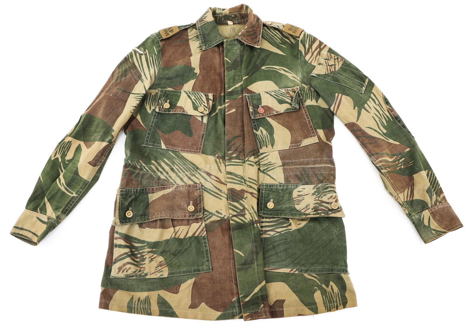 RHODESIAN BUSH WAR BRUSHSTROKE CAMO FIELD JACKET: RHODESIAN BUSH WAR BRUSHSTROKE CAMO FIELD JACKET Rhodesian Bush War "Brushstroke" Camo Combat Field Jacket. BSAP reserve shoulder boards. Light khaki buttons and re-enforced elbow pads. Pattern withou