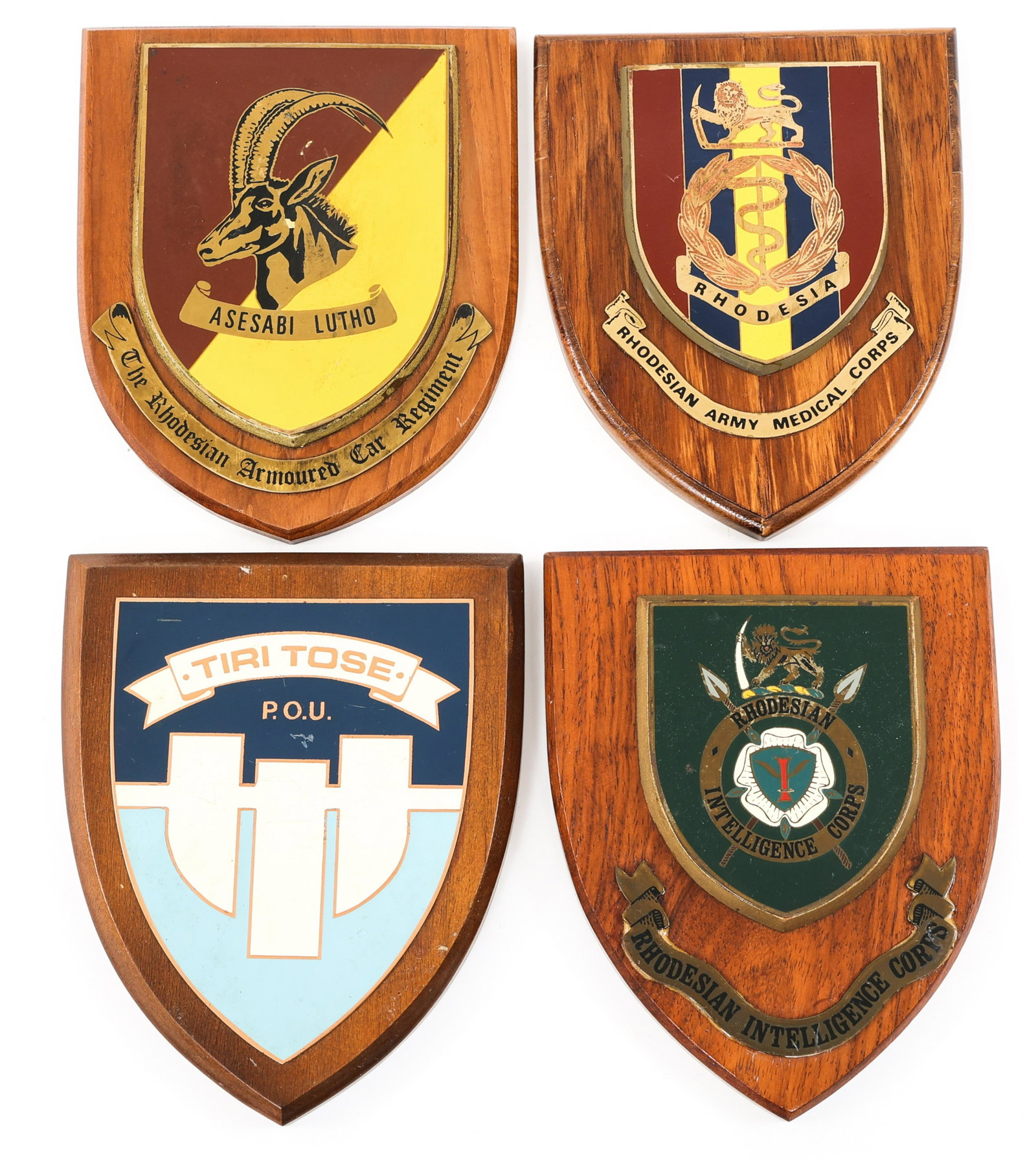 RHODESIAN INTELLIGENCE - PSY OPS & OTHERS PLAQUES: RHODESIAN INTELLIGENCE - PSY OPS & OTHERS PLAQUES Lot of 4 Rhodesian Plaques. (1) Rhodesian Intelligence Corps. (1) Rhodesian Psychological Operations Unit. (1) Rhodesian Armored Corps. (1) Rhodesian 