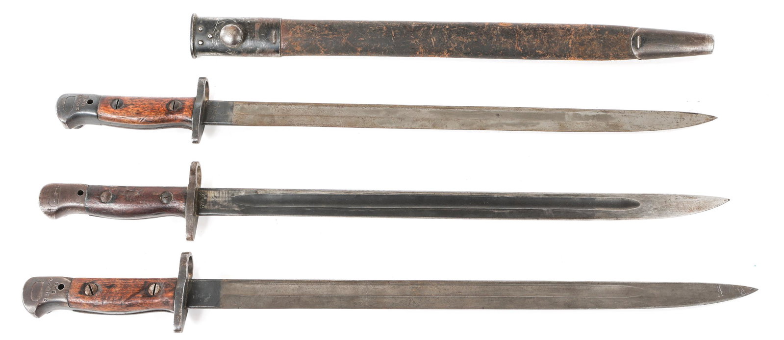 WWI BRITISH ENFIELD MODEL 1907 BAYONET LOT OF 3: WWI BRITISH ENFIELD MODEL 1907 BAYONET LOT OF 3 Lot of 3 British Enfield 1907 Pattern bayonets. (1) M1907 by Wilkinson with leather scabbard. (2) M1907 without scabbards. All of them bear various make