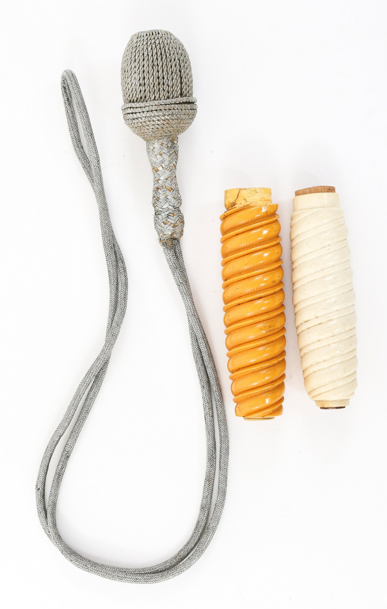 WWII GERMAN ARMY - LUFT DAGGER HANDLE & PORTEPEE: WWII GERMAN ARMY - LUFT DAGGER HANDLE & PORTEPEE Lot of 3. (1) WWII German Army dagger orange handle. Cracked on the lower part. (1) German Luftwaffe white handle. (1) German dagger portepee, silver w