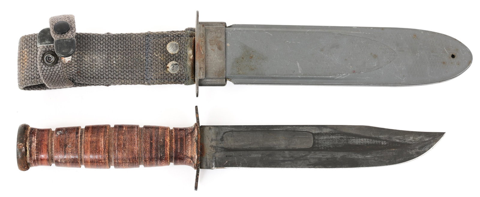 WWII USN MARK 2 COMBAT UTILITY KNIFE BY KA-BAR: WWII USN MARK 2 COMBAT UTILITY KNIFE BY KA-BAR WWII USN Mark 2 Utility / Combat Knife. Parkerized clip point blade with fuller. Stamped under the cross guard "USN Mark 2" on one side and "KA-BAR" on t