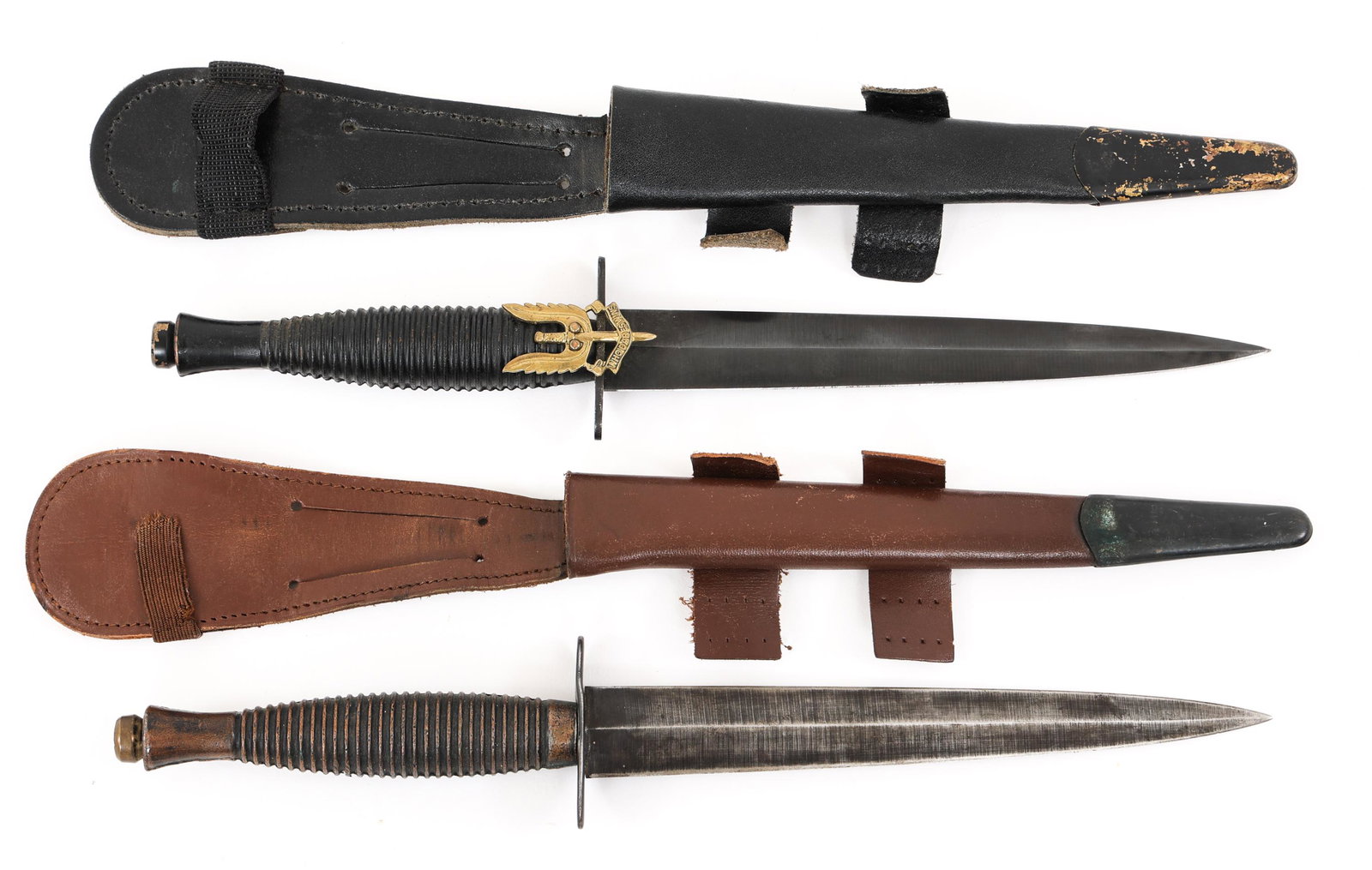 BRITISH FAIRBAIRN SYKES COMBAT KNIVES LOT OF 2: BRITISH FAIRBAIRN SYKES COMBAT KNIVES LOT OF 2 Lot of 2 British Commando Fairbairn Sykes Stiletto Knives. (1) Fairbairn Sykes knife with light brown leather sheath. Diamond section flattened blued bla
