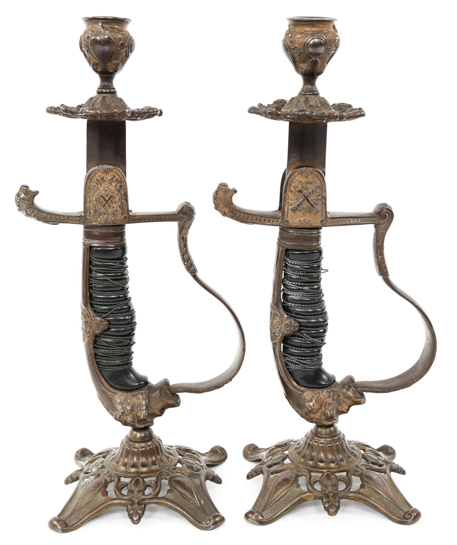 IMPERIAL GERMAN LIONHEAD SWORD CANDLE HOLDERS: IMPERIAL GERMAN LIONHEAD SWORD CANDLE HOLDERS Pair of Imperial German "Lionhead" Sword & Brass Candlestick Holders. Size: 11.5" tall
