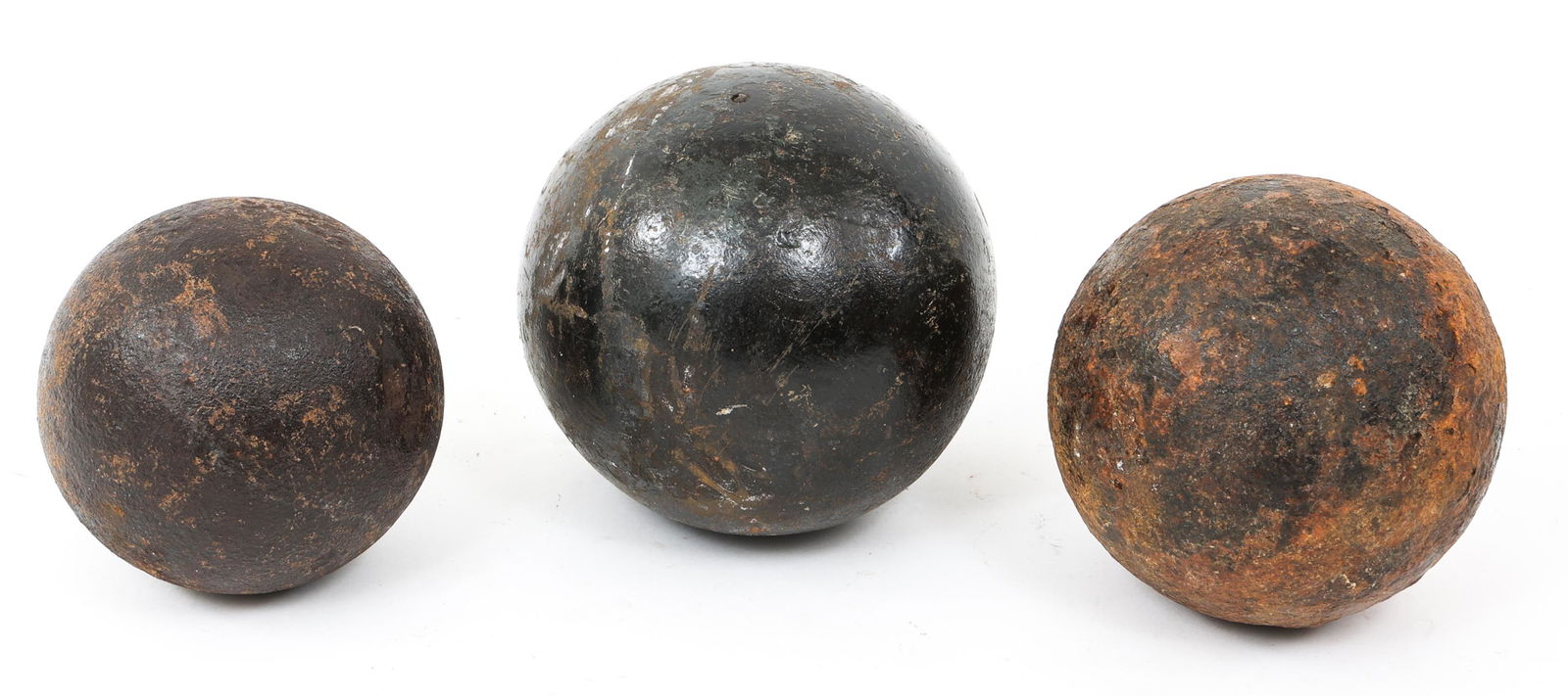 CIVIL WAR EXCAVATED CANNON BALL LOT OF 3: CIVIL WAR EXCAVATED CANNON BALL LOT OF 3 Lot of 3 Civil War Excavated Cannon Ball. (1) 12-Pound Round Solid Shot (Vicinity of the Battle of Fredericksburg, VA). (1) 4” diameter Round Solid Shot (Vic