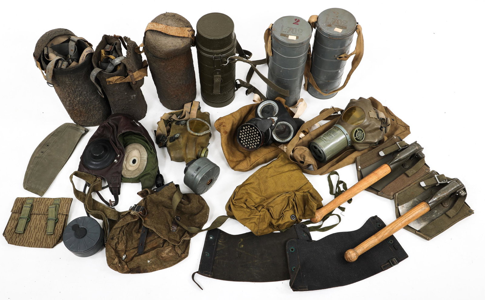 WORLD ARMY MILITARY GAS MASK & FIELD GEAR LOT: WORLD ARMY MILITARY GAS MASK & FIELD GEAR LOT Cold War Era, Mixed Lot of World Army, Military Gas Masks, Shovels, Headgear, Flight Helmet and Field Gear.