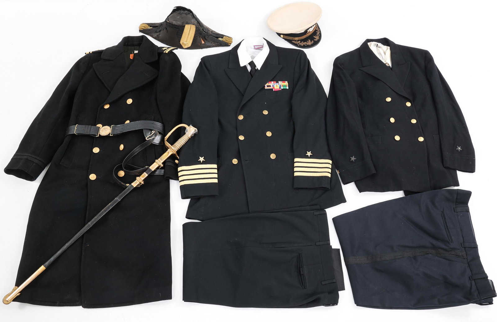 WWII USN NAVAL OFFICER DRESS UNIFORM & SWORD: WWII USN NAVAL OFFICER DRESS UNIFORM & SWORD WWII USN Naval Officer's Uniforms & Sword. Including: (1) US Navy M1852 Naval Officer Dress Sword, circa 1930's. Acid etched straight blade with fuller. Ma