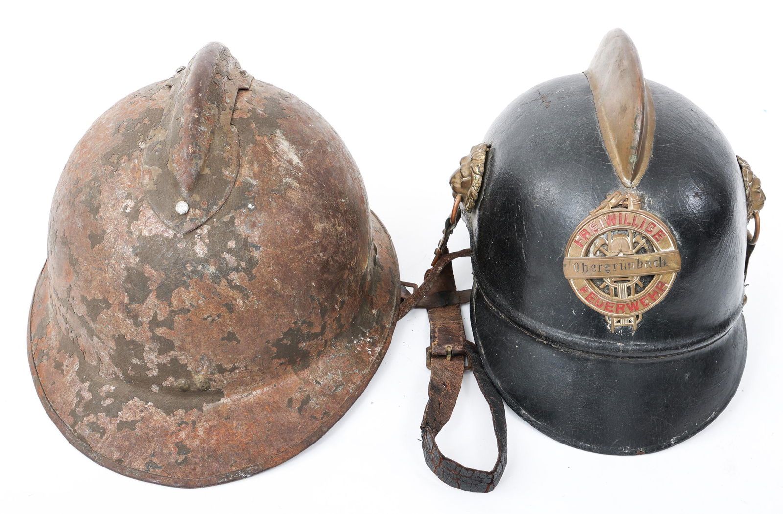 WWI IMPERIAL GERMAN FIREFIGTHER & FRENCH HELMETS: WWI IMPERIAL GERMAN FIREFIGTHER & FRENCH HELMETS Lot of 2 Helmets. (1) WWI Imperial German City Firefighter leather helmet with brass fittings. (1) WWII French Model 1926 Adrian combat helmet.