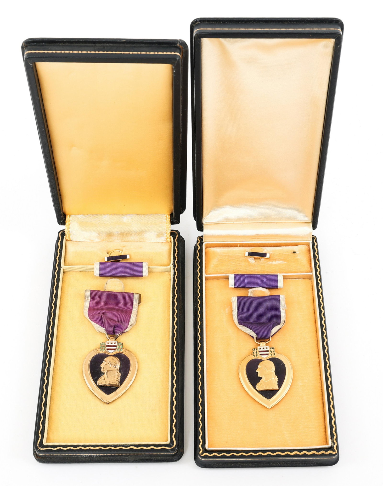 WWI - WWII NAMED PURPLE HEART MEDAL LOT OF 2: WWI - WWII NAMED PURPLE HEART MEDAL LOT OF 2 WWI - WWII Purple Heart Medals. (1) WWI - 1932 Bailey Banks & Biddle Purple Heart Medal set, named to "William Flynn", serial number "56182". Made of Bronz