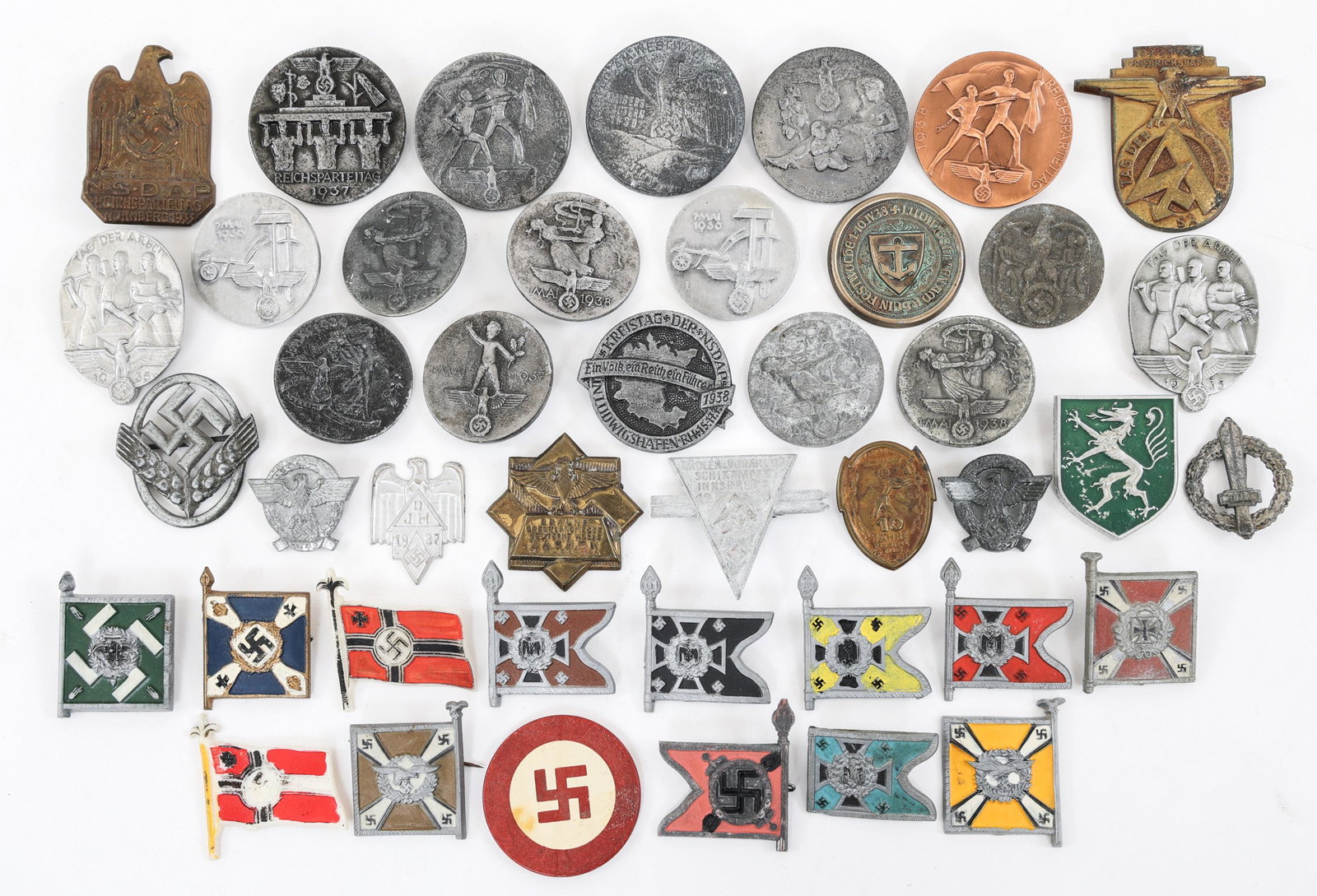 WWII GERMAN POLITICAL TINNIES & FLAG PINS LOT: WWII GERMAN POLITICAL TINNIES & FLAG PINS LOT Mixed lot of Approx. 44 WWII German Political Tinnies & Regimental Flag Pins. Various sizes and maker marks.