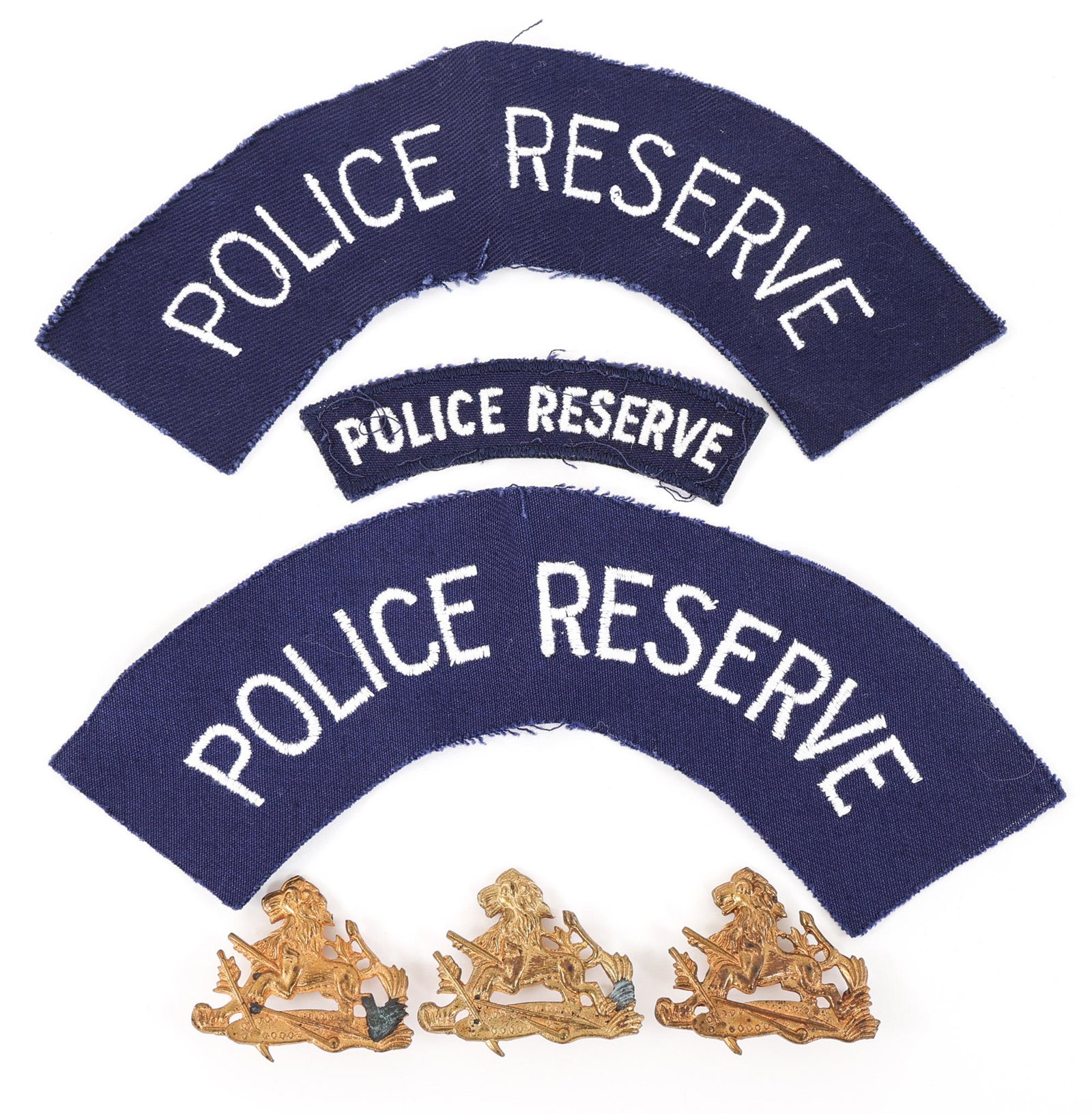RHODESIA BSAP RESERVE BADGES & SHOULDER PATCHES: RHODESIA BSAP RESERVE BADGES & SHOULDER PATCHES Lot of 6 Rhodesian BSAP Police Reserve Cap Badges & Shoulder Patches. Provenance | The Dublin Trust Collection: Personal effects of a U.S. Citizen, who 