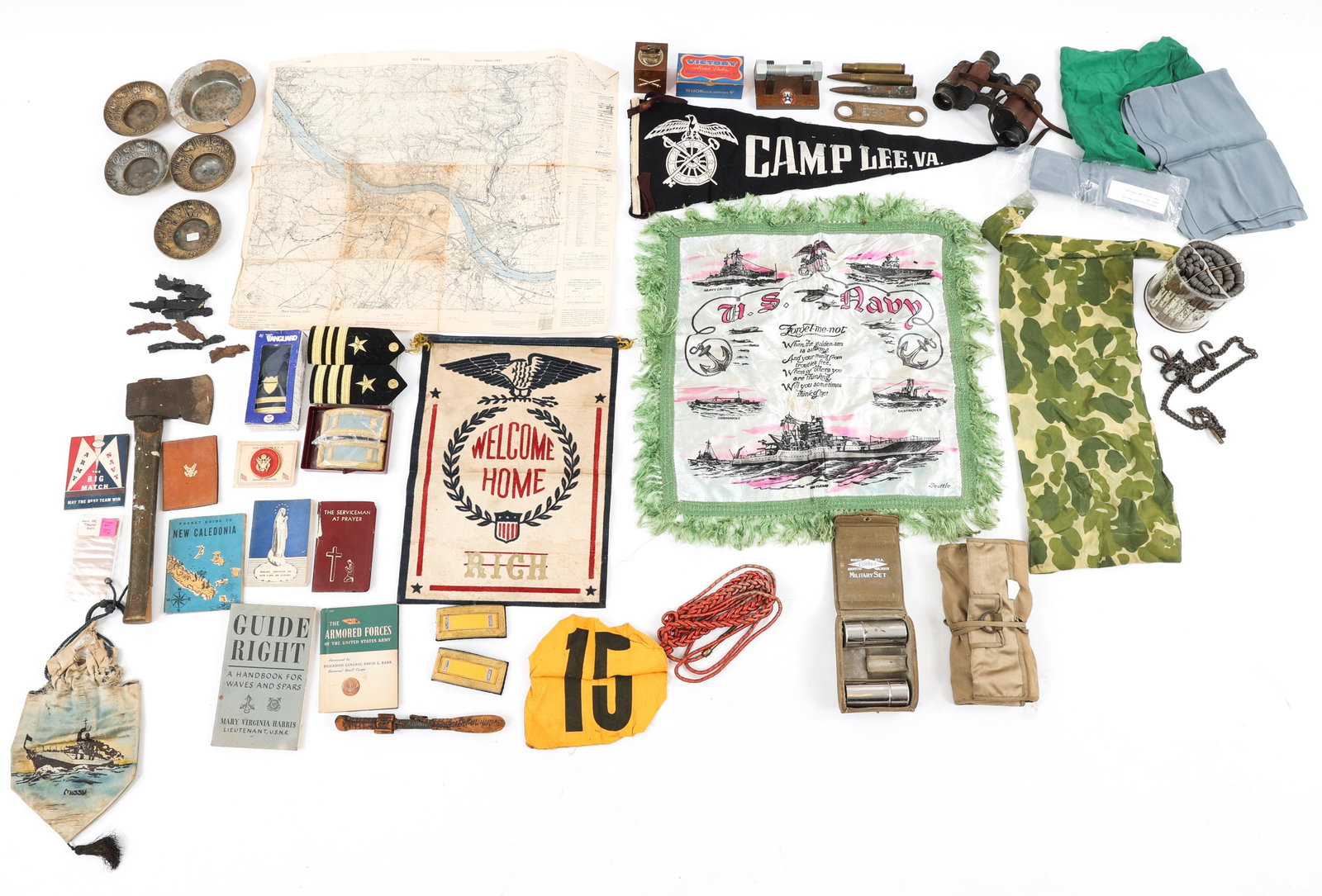 WWI - WWII US MILITARY COLLECTIBLE BONANZA LOT: WWI - WWII US MILITARY COLLECTIBLE BONANZA LOT WWI - WWII US Military Collectible Bonanza Lot. Includes; Waves, Serviceman prayer, and other guide books; Officer shoulder boards; Map; Bring back shrap