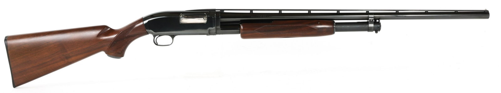 WINCHESTER MODEL 12 20 GAUGE PUMP ACTION SHOTGUN: WINCHESTER MODEL 12 20 GAUGE PUMP ACTION SHOTGUN Winchester Model 12 20 gauge pump action shotgun. 26 inch ribbed barrel with 2 3/4" chamber and Improved Cylinder choke. Black finish. Checkered walnut