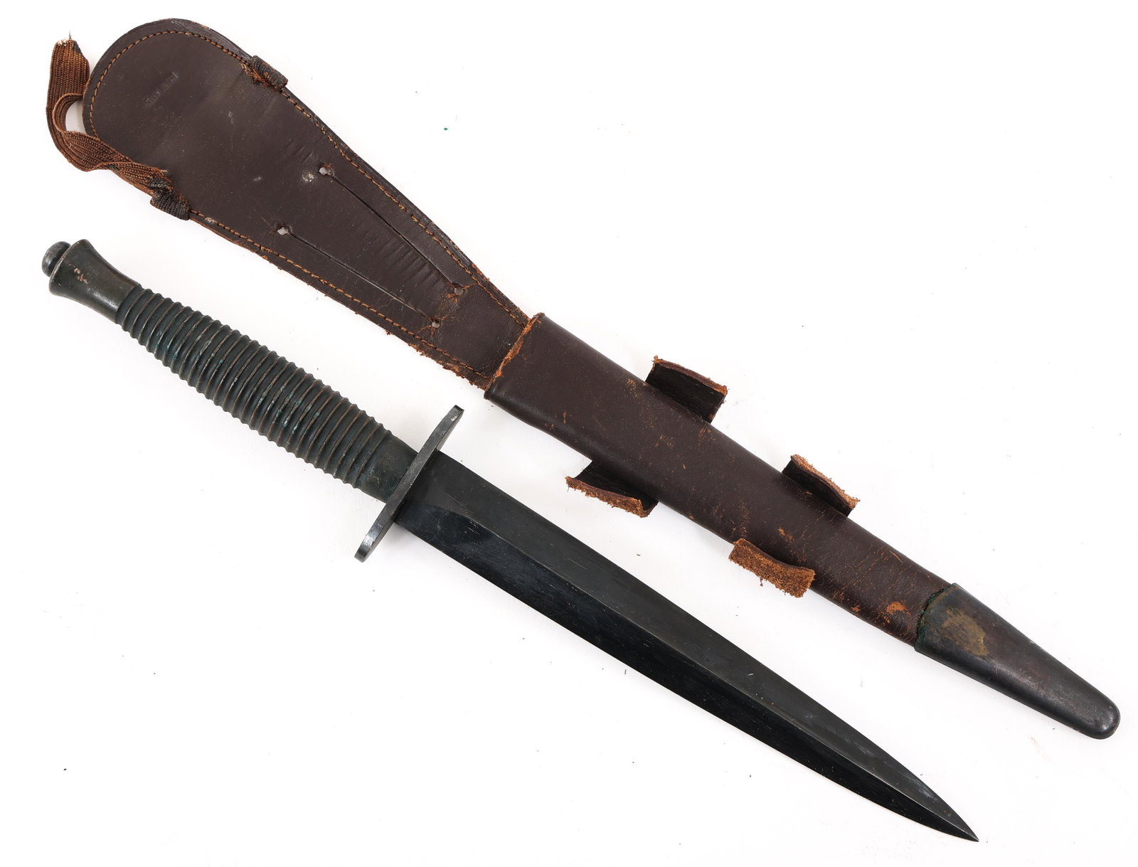 WWII FAIRBAIRN SYKES THIRD PATTERN KNIFE: WWII FAIRBAIRN SYKES THIRD PATTERN KNIFE | WWII Fairbairn Sykes Third Pattern Knife. Blued dagger blade. 2" oval guard with the broad-arrow and No. 21 stamped under "England". Blackened brass ribbed h