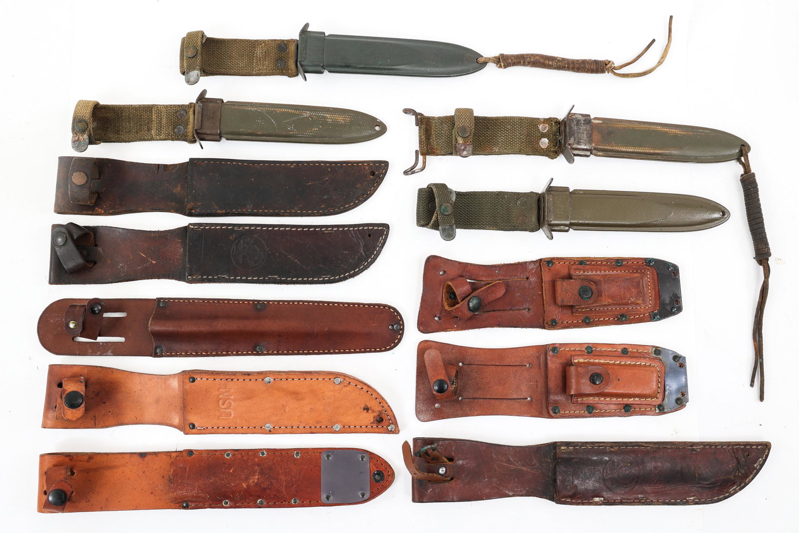 WWII - COLD WAR US ARMY USM8 & LEATHER SHEATH LOT: WWII - COLD WAR US ARMY USM8 & LEATHER SHEATH LOT | Lot of WWII - Cold War US Army Scabbards and Leather Sheaths. (4) WWII M3 combat knife / M4 bayonet USM8 scabbard. (4) WWII - Cold War USN / USMC Ma