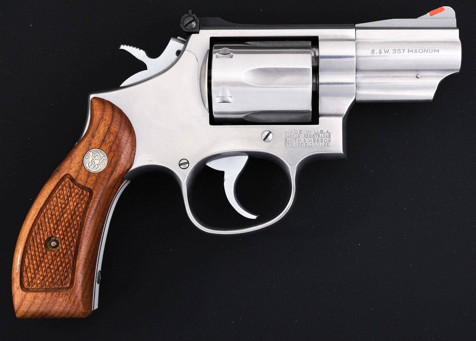 SMITH & WESSON 66-3 DA .357 MAGNUM CAL REVOLVER: SMITH & WESSON 66-3 DA .357 MAGNUM CAL REVOLVER Smith & Wesson Model 66-3 double action .357 Magnum caliber revolver. Stainless steel frame. Wood grips. Blade front sight with red insert. Adjustable r