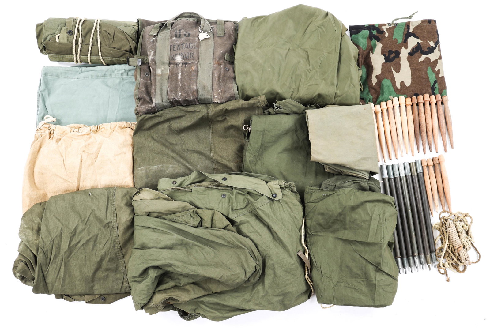 WWII - COLD WAR BAGS, TENTS, & COVERS MIXED LOT: WWII - COLD WAR BAGS, TENTS, & COVERS MIXED LOT Mixed lot of WWII - Cold War bags, tents, and covers including (1) 1945 US Military tent stakes, dated 1945. (1) US Military human remains bag. (1) WWII