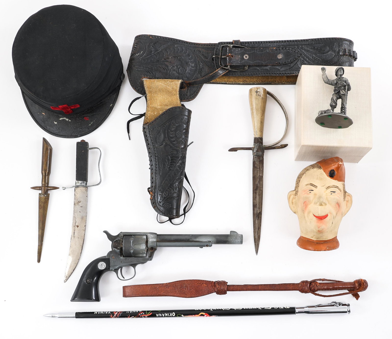 US MILITARY COLLECTIBLES BONANZA LOT: US MILITARY COLLECTIBLES BONANZA LOT Military collectibles bonanza lot. Includes: Hand made knives; Decorated swagger stick; Fraternal hat; Cow-Boy style holster with blank revolver; figure and more.