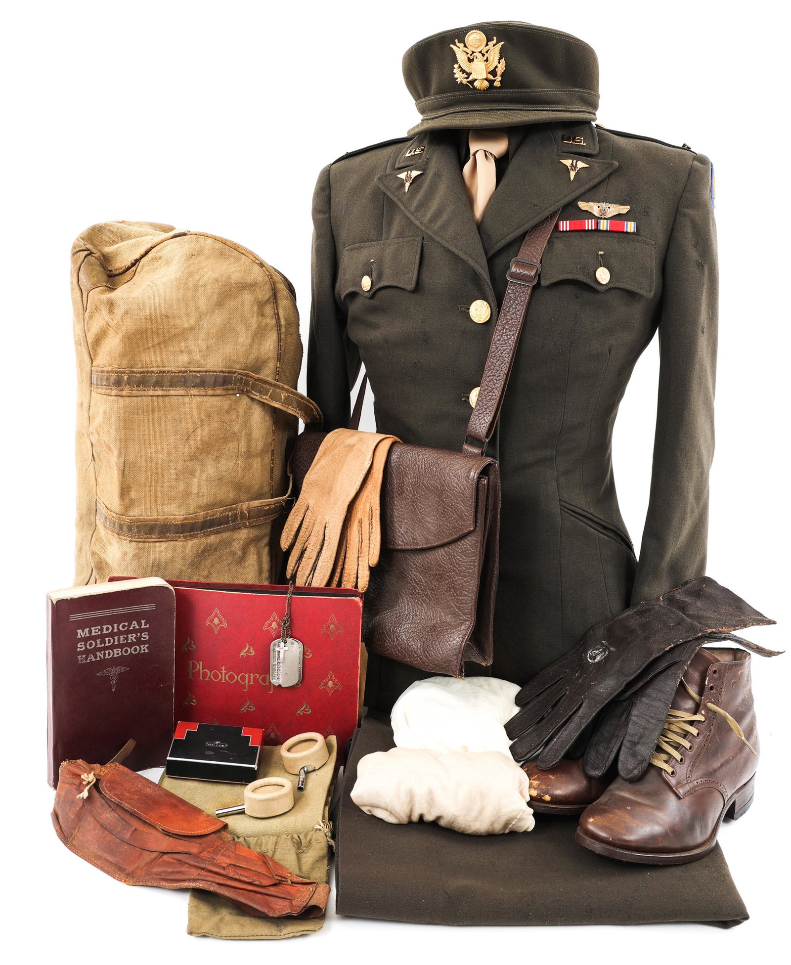 WWII US ARMY FLIGHT NURSE NAMED UNIFORM GROUPING: WWII US ARMY FLIGHT NURSE NAMED UNIFORM GROUPING WWII US Army Flight Nurse Named Uniform Grouping. Identified to 1st Lieutenant Thelma L. Capwell, N-790452. Including (1) Olive-Drab service tunic with