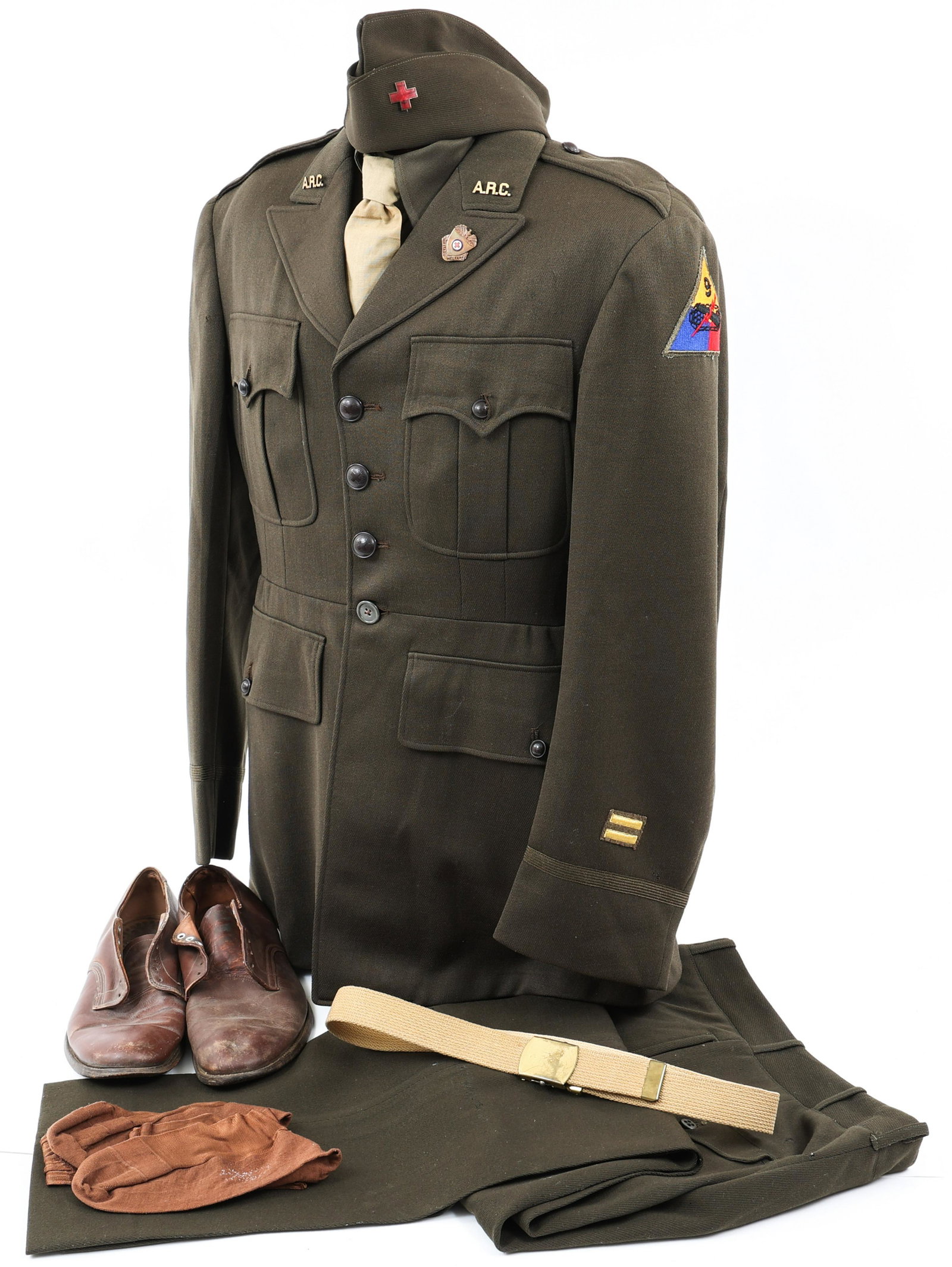 WWII US ARC RED CROSS OFFICER UNIFORM GROUPING: WWII US ARC RED CROSS OFFICER UNIFORM GROUPING WWII US Army ARC, American Red Cross / 9th Armored Division Officer Uniform Grouping. Includes (1) Dark Elastic, 4 pockets Officer tunic with ARC buttons
