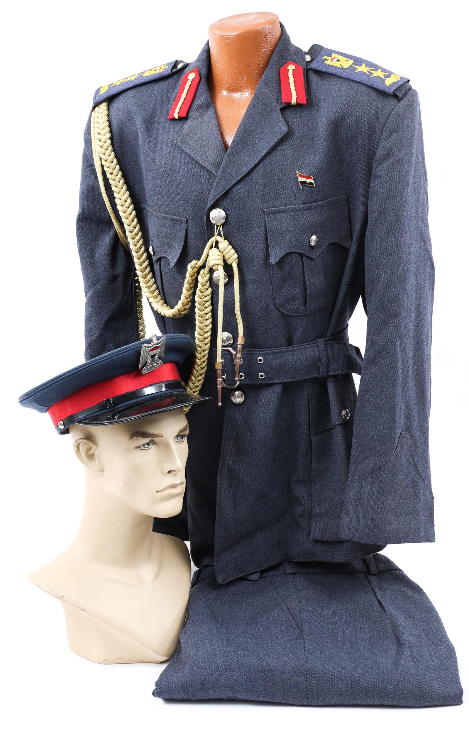 DESERT STORM IRAQI AIR FORCE OFFICER UNIFORM: DESERT STORM IRAQI AIR FORCE OFFICER UNIFORM Desert Storm, Iraqi Air Force Officer Dress Uniform. Including Tunic with shoulder boards and aiguillettes, straight trousers and dress hat. Size: large