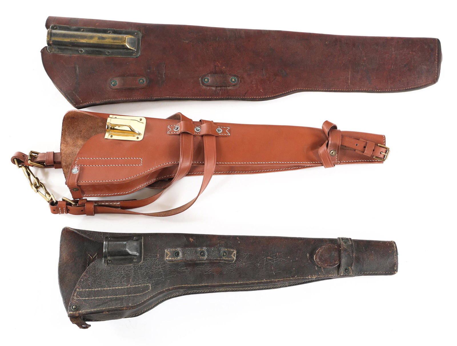M1 CARBINE AND M1 GARAND JEEP SCABBARDS LOT: M1 CARBINE AND M1 GARAND JEEP SCABBARDS LOT M1 Carbine and M1 Garand Jeep scabbards lot. A) WWII M1 Garand leather Jeep scabbard. Scabbard is stamped "U.S. Milwaukee Saddlery Co. 1942". B) M1 Carbine 