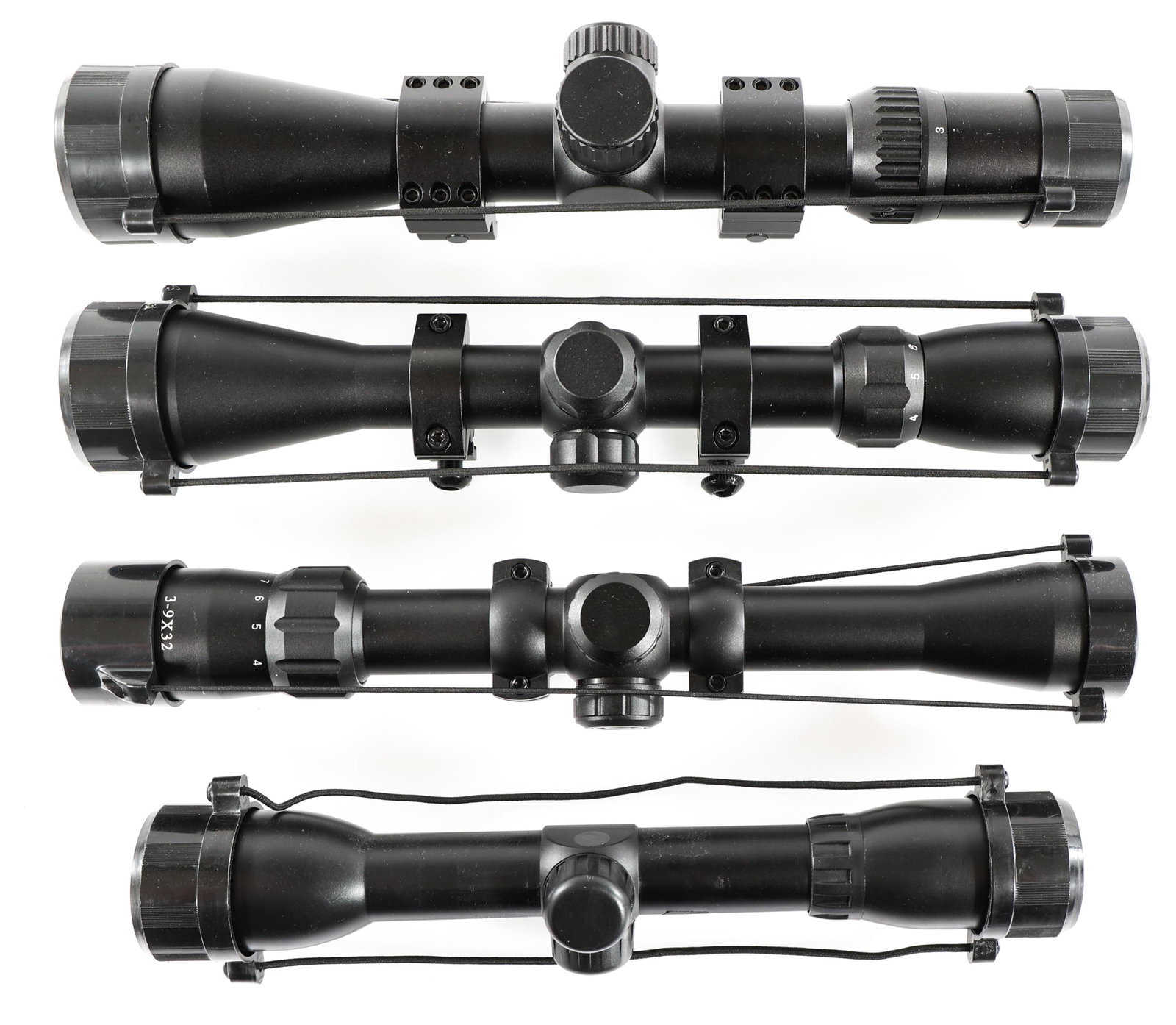 RIFLE SCOPES LOT OF 4: RIFLE SCOPES LOT OF 4 A) Simmons 3-9x32 rifle scope. Marked "22 Mag". Scope ring mounts and lens covers. Second focal plane. B) Unmarked 3-9x40 rifle scope. Scope ring mounts and lens covers. Second f