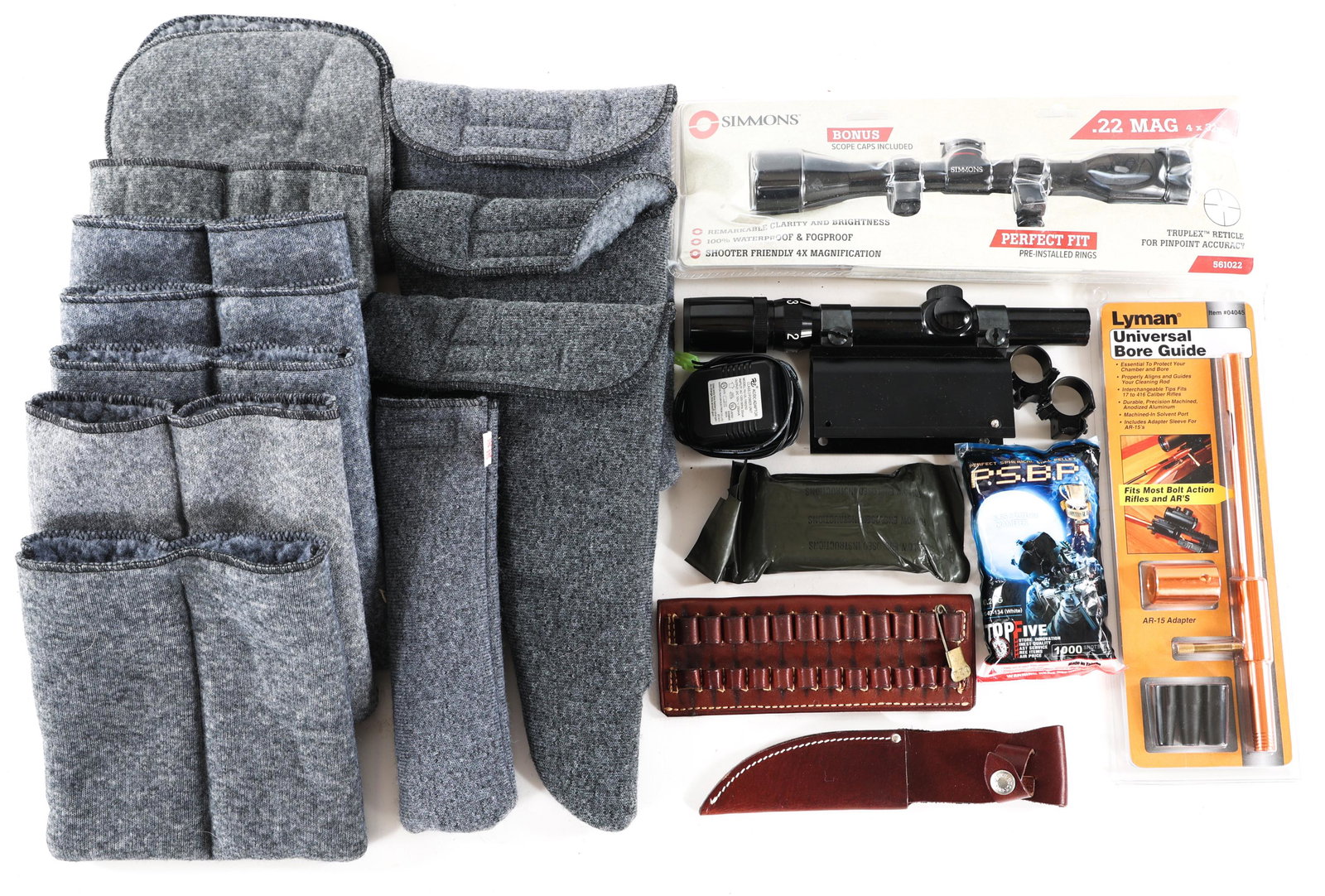 FIREARM ACCESSORIES - OPTICS, CASES & MORE: FIREARM ACCESSORIES - OPTICS, CASES & MORE Mixed firearm accessories lot. Includes: Bushnell 4x15x Banner scope, Simmons .22 MAG 4x32mm scope. Lyman universal bore guide. First aid field dressing. Lea