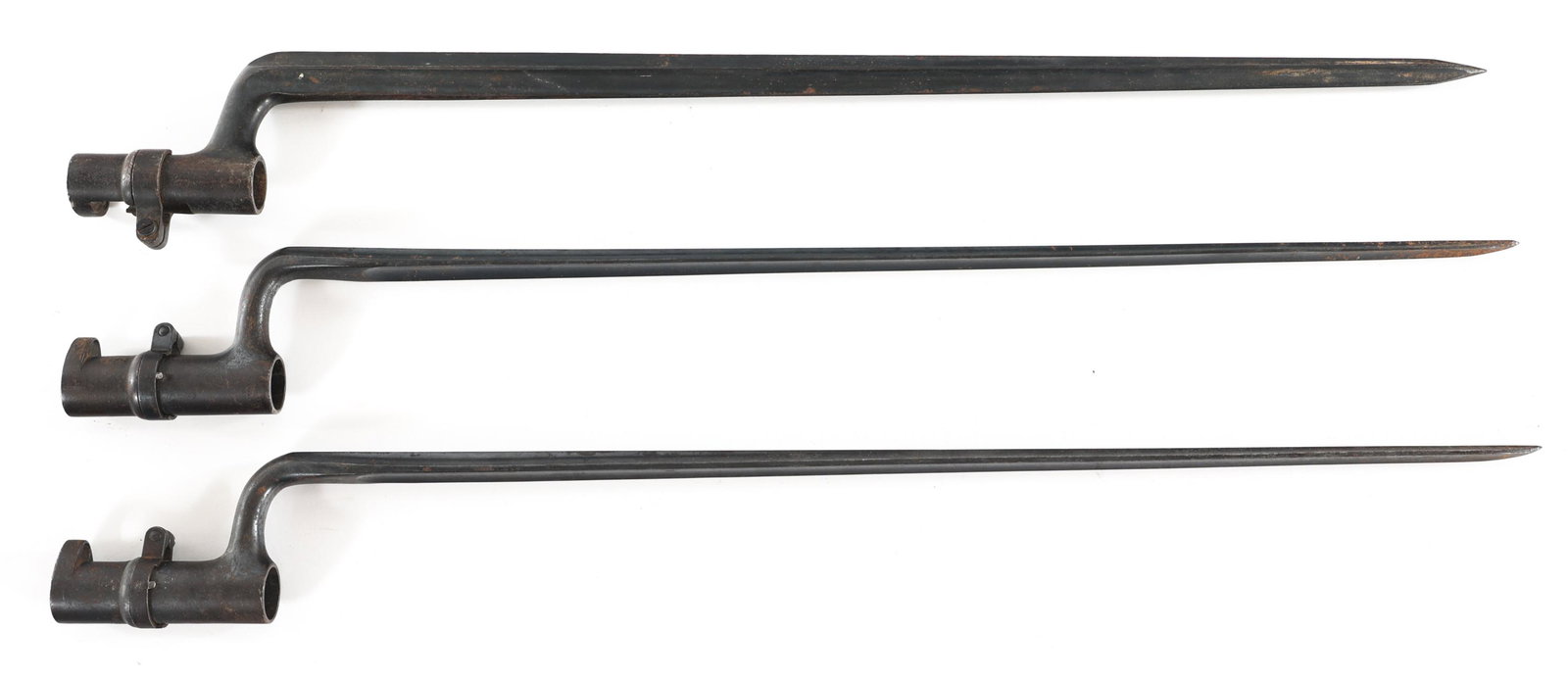 SOCKET BAYONETS LOT OF THREE: SOCKET BAYONETS LOT OF THREE Lot of three socket bayonets. Two are US marked triangular. One cruciform. Blade Length: 18" Total Length: 21.50"