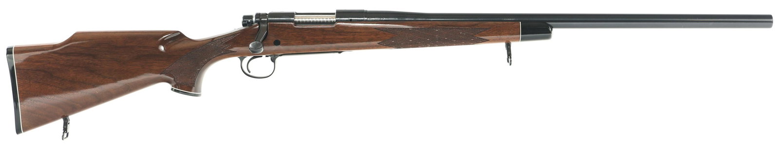 1977 REMINGTON MODEL 700 .243 WIN CALIBER RIFLE: 1977 REMINGTON MODEL 700 .243 WIN CALIBER RIFLE 1977 Remington Model 700 bolt action .243 Winchester caliber rifle. Blued finish. Checkered walnut stock. 24" bull barrel. Sling mounts. No sights. Prov