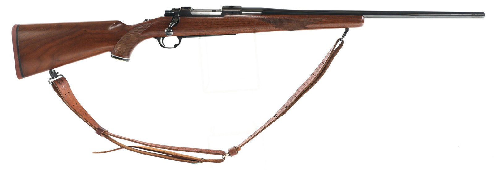 RUGER MODEL 77 .243 WIN CAL BOLT ACTION RIFLE: RUGER MODEL 77 .243 WIN CAL BOLT ACTION RIFLE 1985 Ruger Model 77 .243 Win caliber bolt action rifle. Receiver mounted ribbed scope rails. No sights. Checkered wood stock. EEM monogrammed wrist cap. R