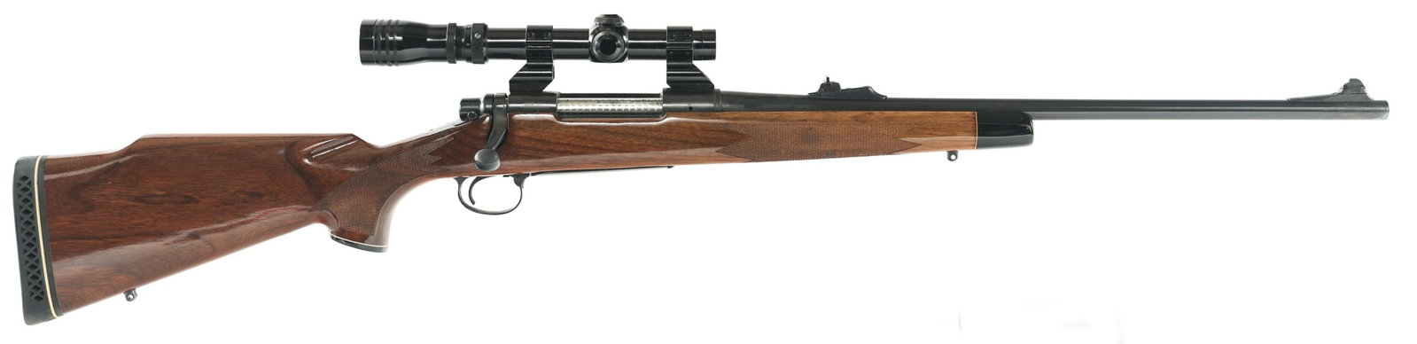 1975 REMINGTON MODEL 700 .270 WIN CALIBER RIFLE: 1975 REMINGTON MODEL 700 .270 WIN CALIBER RIFLE 1975 Remington Model 700 bolt action .270 Winchester caliber rifle. Blued finish. Checkered walnut stock. Adjustable rear sight. Swivel studs. Rubber Pa