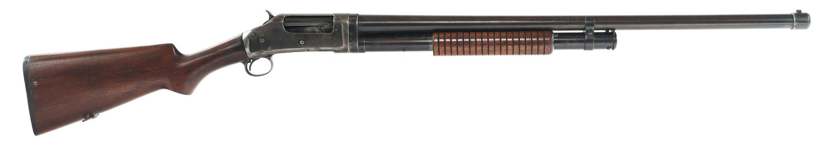 1940 WINCHESTER MODEL 97 PUMP ACTION 12 GA SHOTGUN: 1940 WINCHESTER MODEL 97 PUMP ACTION 12 GA SHOTGUN 1940 Winchester Model 97 pump action 12 gauge shotgun. 2.75" chamber. Full choke. Blued finish. Walnut stock and fore grip. Two bead sights. Sling mo