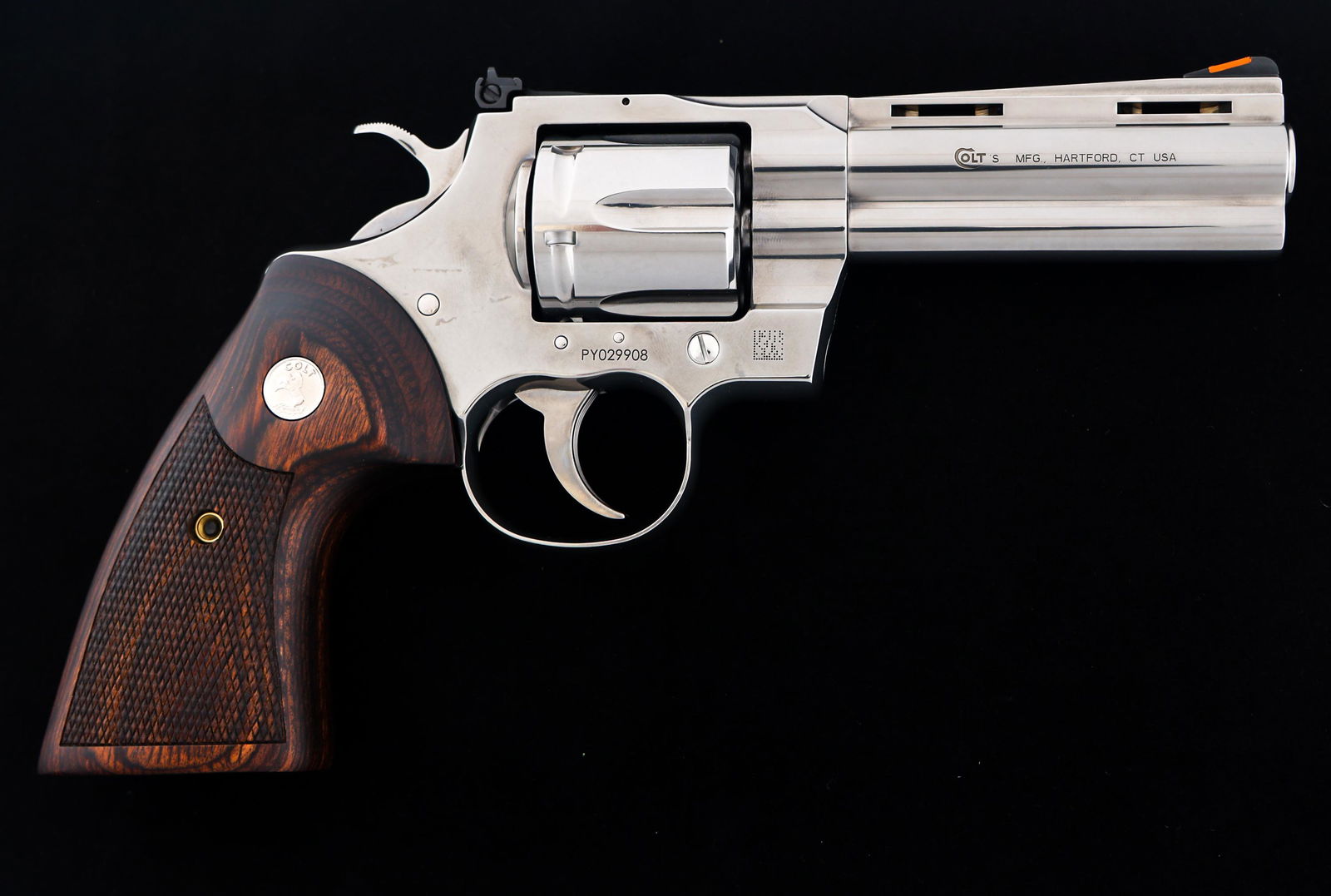 COLT PYTHON .357 MAG CALIBER DA REVOLVER: COLT PYTHON .357 MAG CALIBER DA REVOLVER Colt Python .357 Magnum caliber double action revolver. Adjustable rear sights, front blade sight. Stainless steel. Checkered wood Colt medallion grips. Colt h